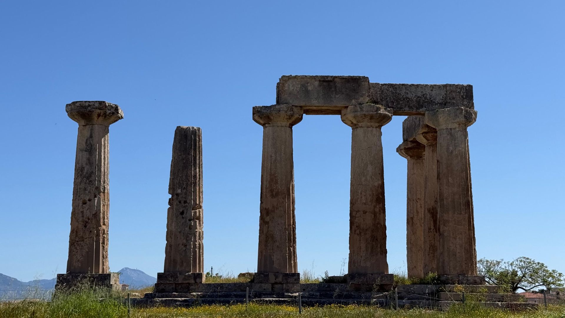 Doric columns of the Temple of Apollo in Ancient Corinth on a Peloponnese hiking tour